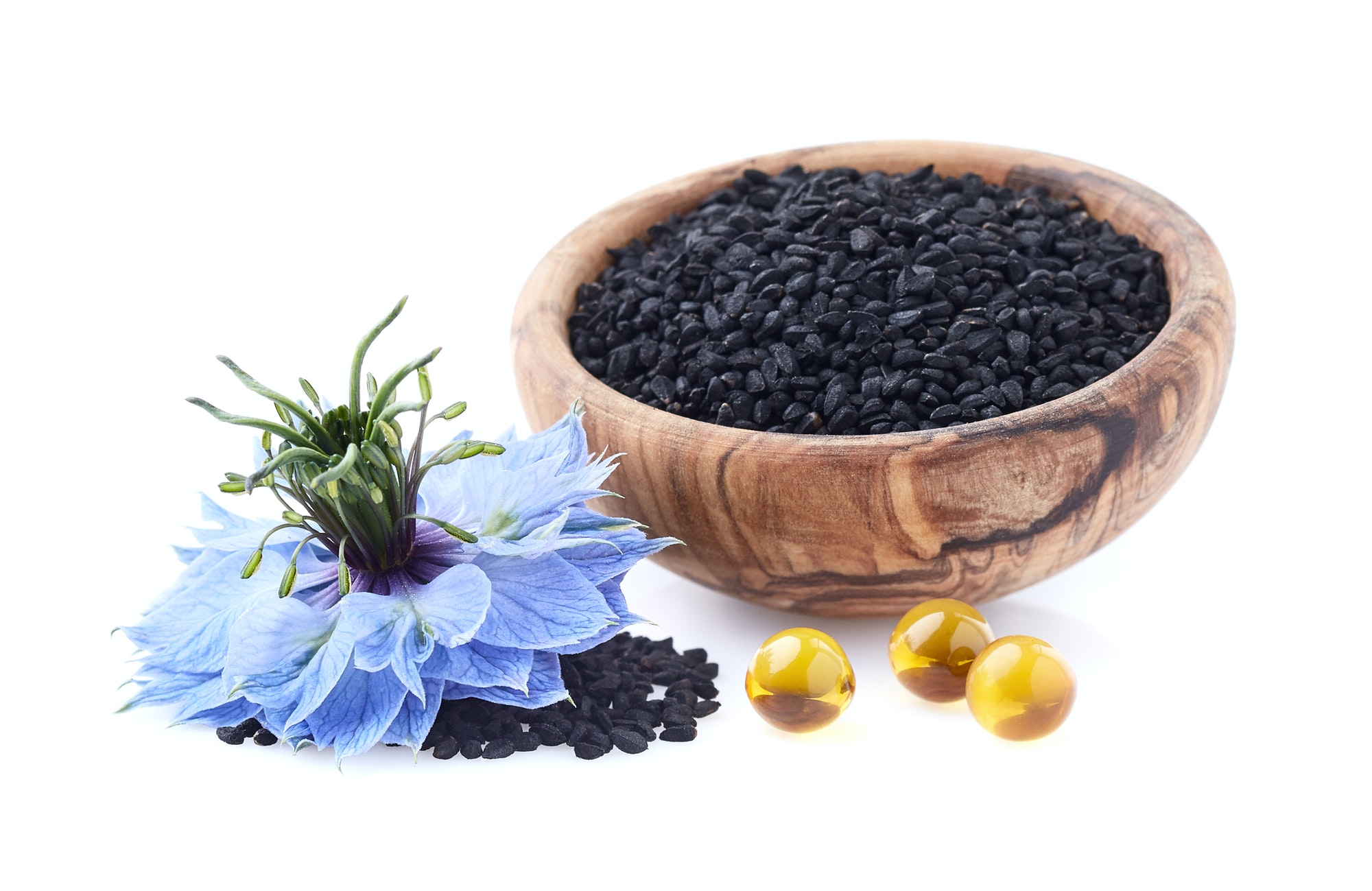 Black cumin seeds with nigella sativa flower